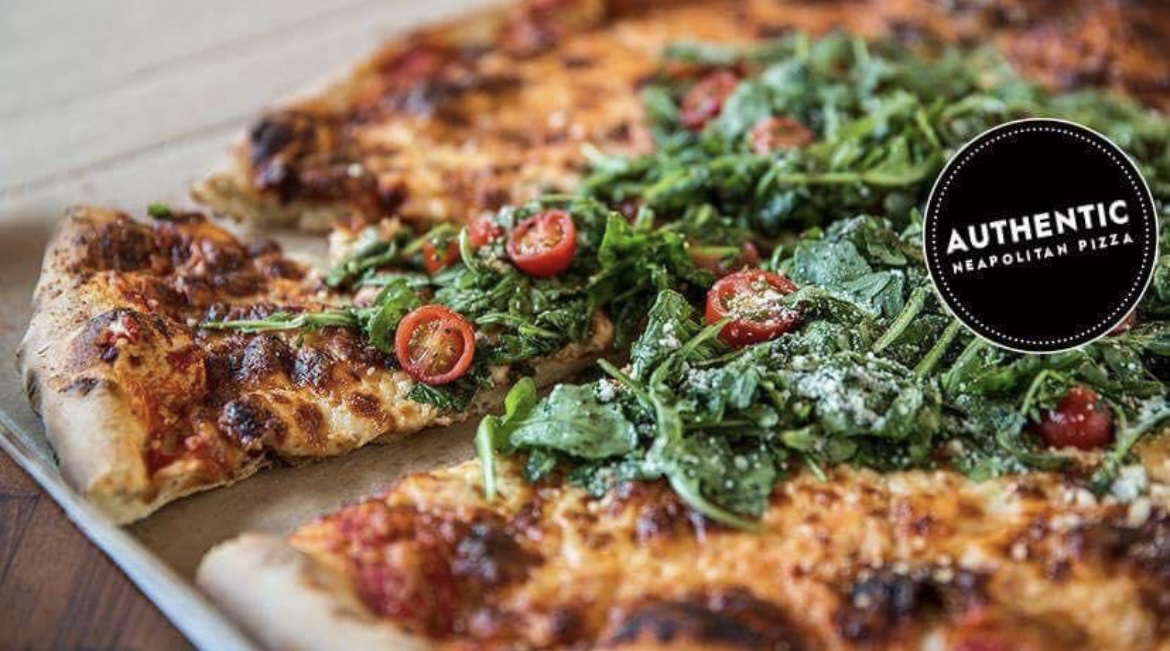 Authentic Neapolitan wood fired pizza with fresh arugula and San Marzano tomatoes - Best Pizza in BC